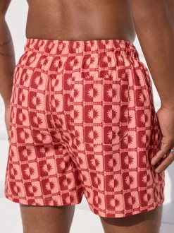 Coral Pink Sun Geometric Printed Swim Shorts