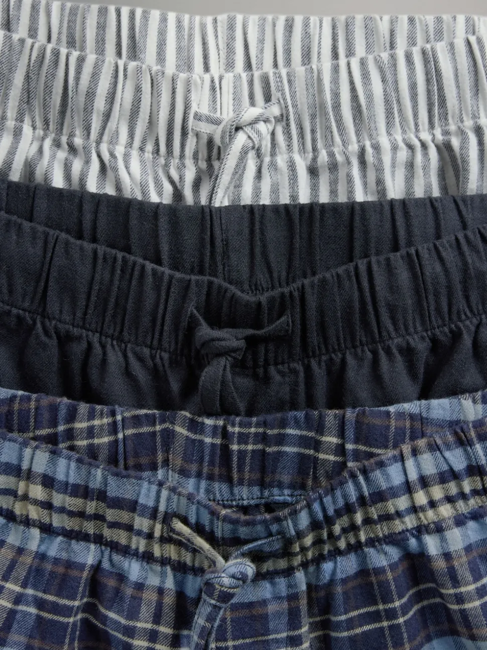 The Set 3 Pack Jersey T-Shirt and Flannel Pyjamas Cream/Grey/Blue